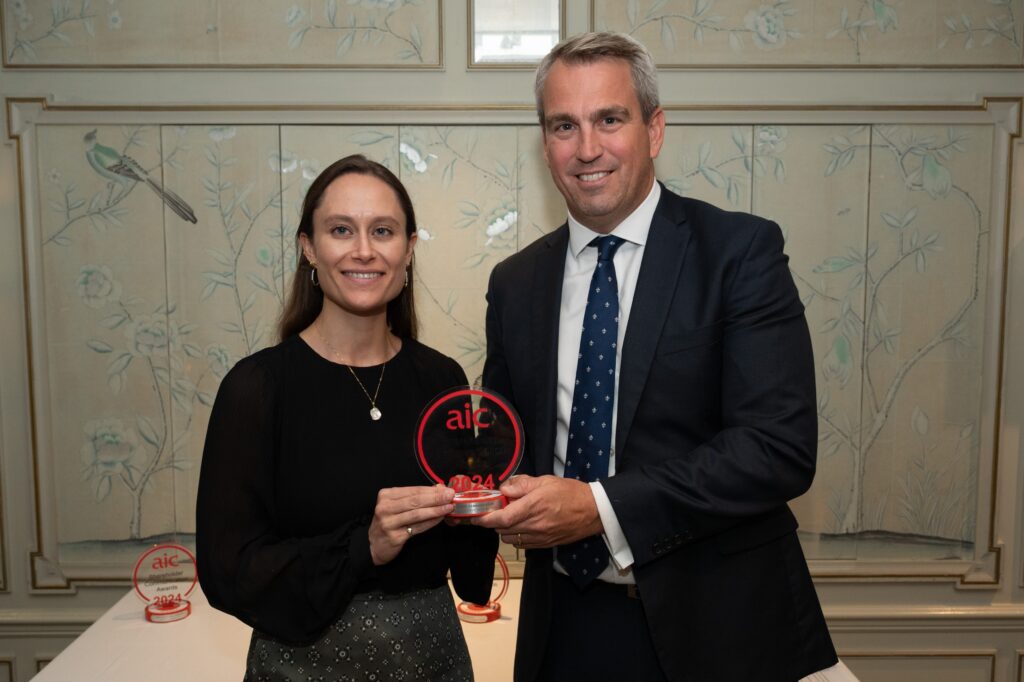 Lucie collecting AIC award