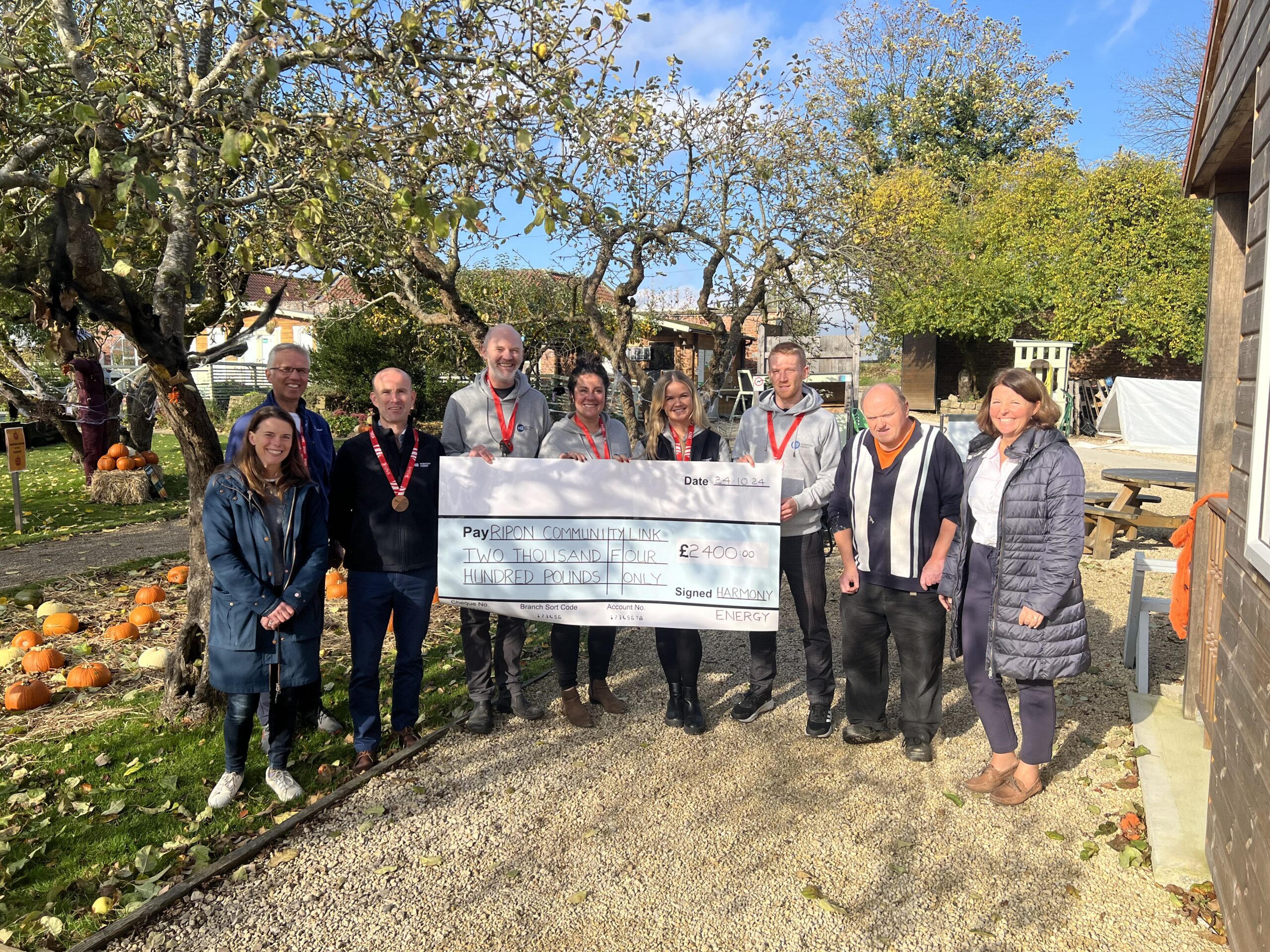 Staff at Ripon Walled Garden showcasing fundraising efforts